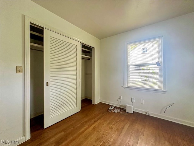 1357 Kearney St, Niles, OH 44446 - unfurnished bedroom with wood finished floors, a closet, and baseboards