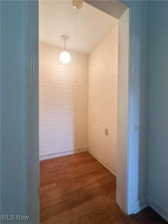 1357 Kearney St, Niles, OH 44446 - unfurnished room with wallpapered walls, wood finished floors, and baseboards