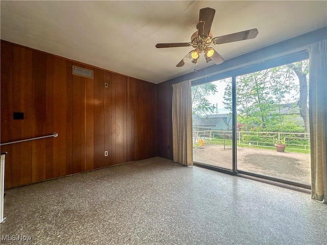 1357 Kearney St, Niles, OH 44446 - unfurnished room featuring wood walls and ceiling fan