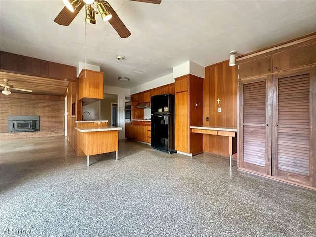 1357 Kearney St, Niles, OH 44446 - kitchen featuring freestanding refrigerator, open floor plan, ceiling fan, brown cabinets, and light countertops