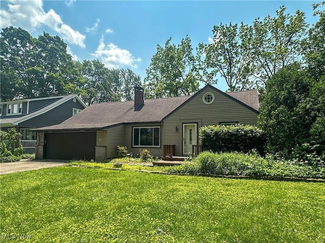 1357 Kearney St, Niles, OH 44446 - view of front facade featuring a garage, a chimney, a front lawn, and concrete driveway