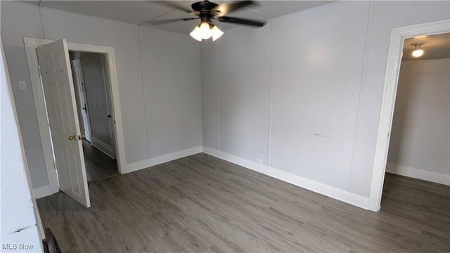unfurnished bedroom with wood finished floors, baseboards, and ceiling fan