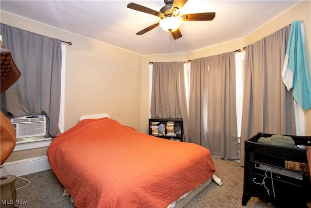bedroom with carpet floors, ceiling fan, and cooling unit