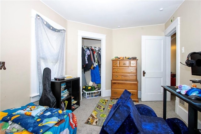 bedroom with carpet floors and a closet