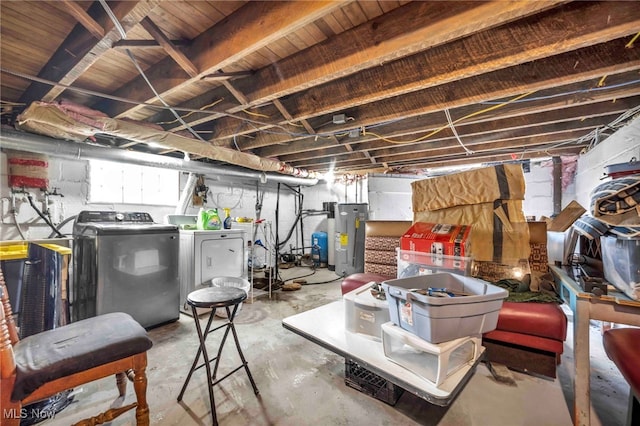 basement with washing machine and dryer and electric water heater