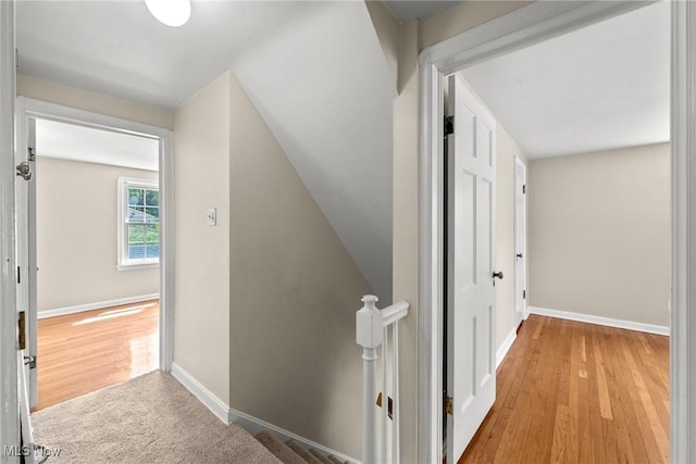149 Sand Run Rd, Akron, OH 44313 - hallway featuring baseboards, wood finished floors, and an upstairs landing