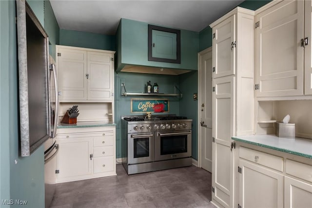 kitchen with stainless steel appliances and white cabinetry