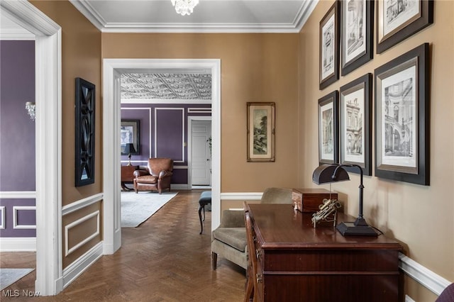 corridor with crown molding and baseboards