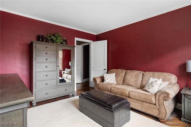 living room with ornamental molding and wood finished floors