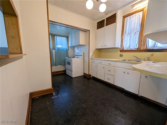 kitchen featuring white range with electric stovetop, light countertops, white cabinetry, a sink, and dark floors