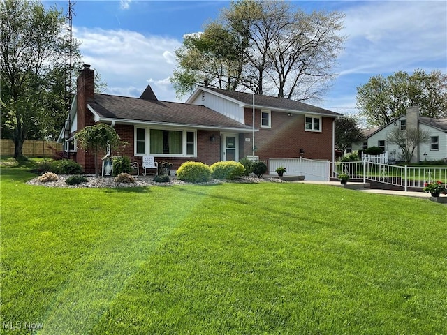 681 Grandview Ave, East Palestine, OH 44413 - rear view of house featuring brick siding, a garage, and a chimney
