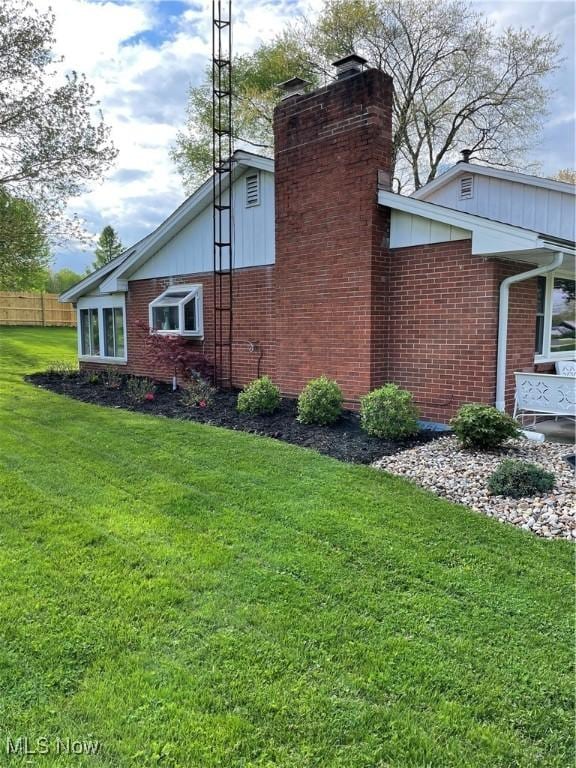 681 Grandview Ave, East Palestine, OH 44413 - view of home's exterior with brick siding and a chimney
