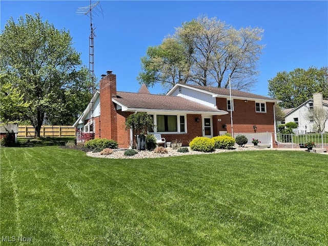 681 Grandview Ave, East Palestine, OH 44413 - rear view of house featuring a chimney and brick siding