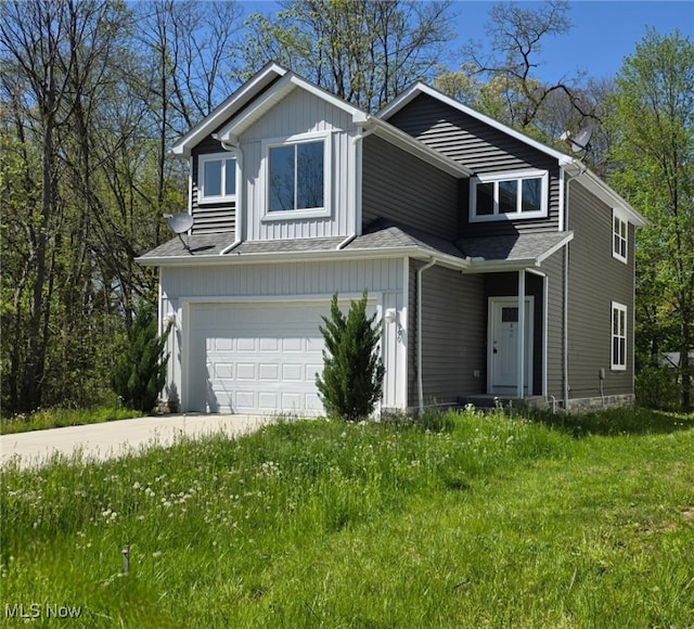 990 E Blvd, Aurora, OH 44202 - view of front of property with an attached garage and concrete driveway