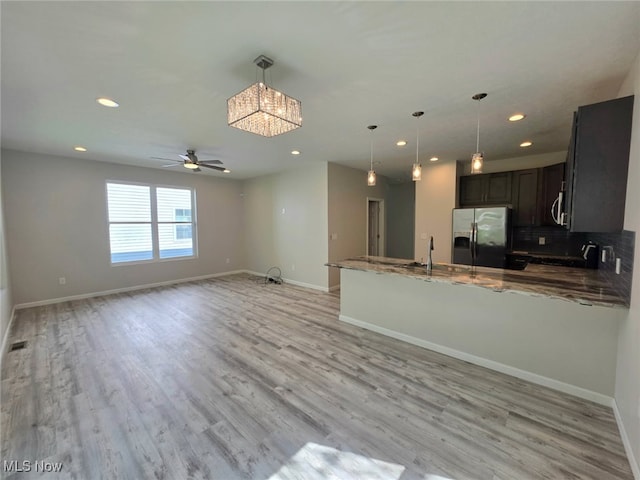 990 E Blvd, Aurora, OH 44202 - kitchen featuring fridge with ice dispenser, recessed lighting, baseboards, a peninsula, and a chandelier