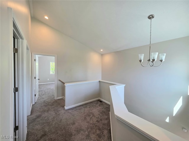 990 E Blvd, Aurora, OH 44202 - corridor with an upstairs landing, dark colored carpet, a chandelier, lofted ceiling, and baseboards