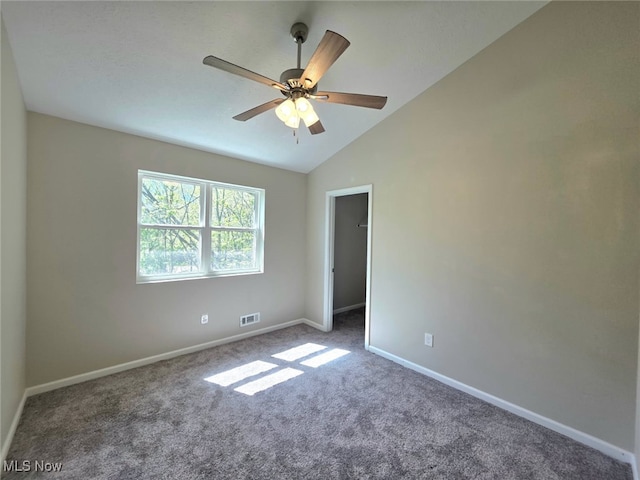 990 E Blvd, Aurora, OH 44202 - spare room with carpet floors, ceiling fan, baseboards, and lofted ceiling