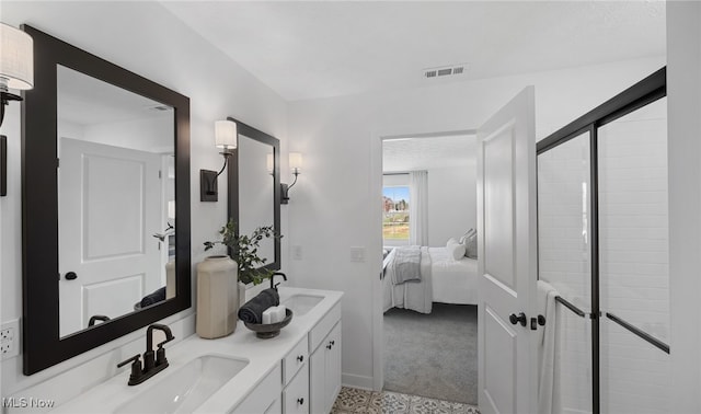 2986 Mcintosh Dr NE, Louisville, OH 44641 - full bathroom featuring ensuite bath, a tile shower, double vanity, and baseboards