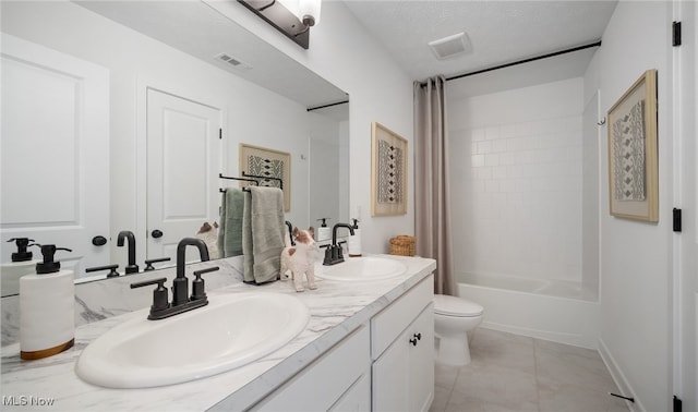 2986 Mcintosh Dr NE, Louisville, OH 44641 - bathroom featuring toilet, double vanity, tile patterned flooring, shower / bathtub combination with curtain, and a textured ceiling