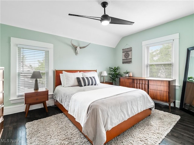bedroom with multiple windows, dark wood-type flooring, lofted ceiling, baseboards, and ceiling fan
