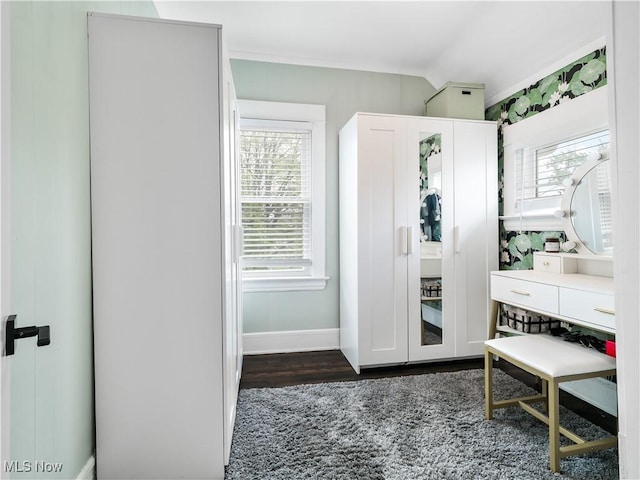 bathroom with wood finished floors and baseboards