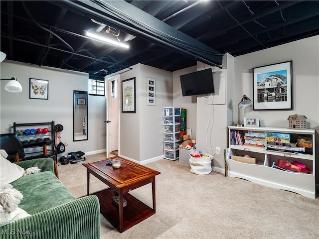 living room with carpet and baseboards