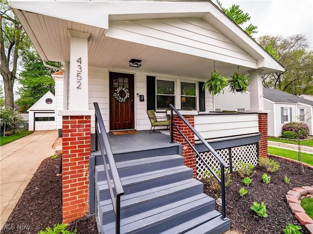 view of front of property featuring a porch and a garage