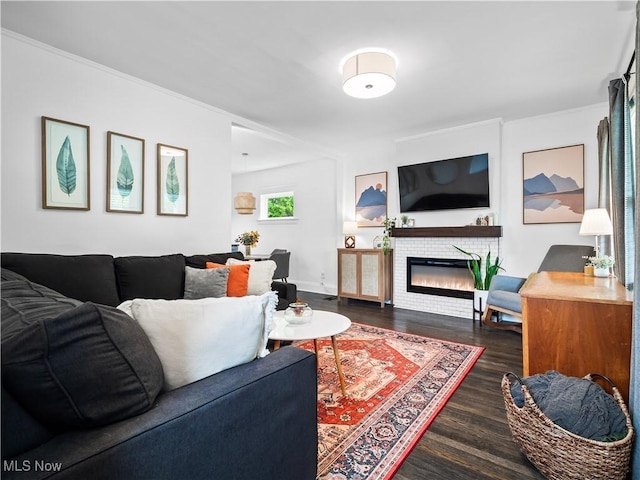 living room featuring wood finished floors and a tile fireplace