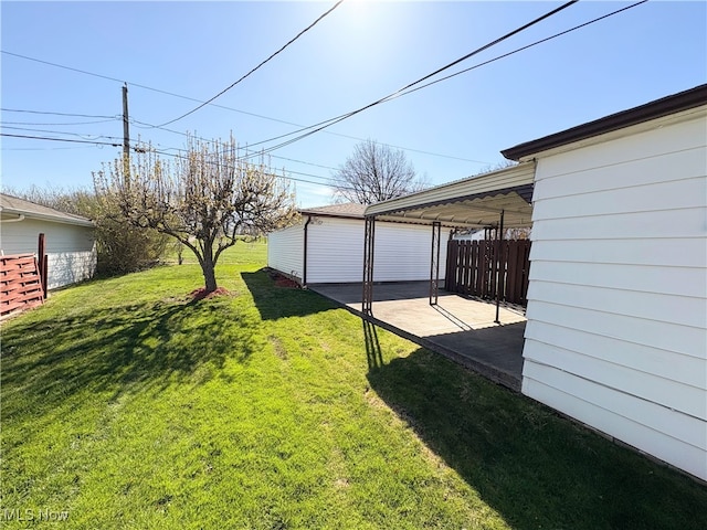 view of yard featuring a patio and a carport