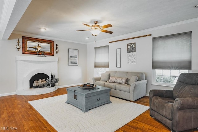5500 12th Ave, Vienna, WV 26105 - living room with ceiling fan, crown molding, wood finished floors, a fireplace, and baseboards
