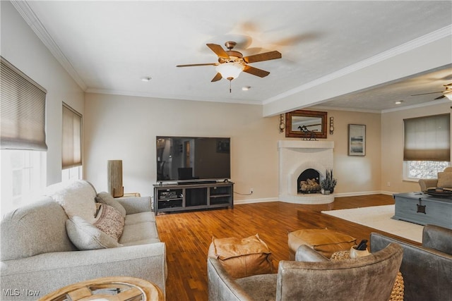 5500 12th Ave, Vienna, WV 26105 - living area with ceiling fan, wood finished floors, a fireplace, crown molding, and baseboards