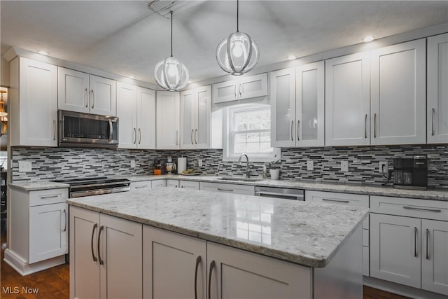 5500 12th Ave, Vienna, WV 26105 - kitchen with stainless steel appliances, a sink, backsplash, recessed lighting, and a kitchen island