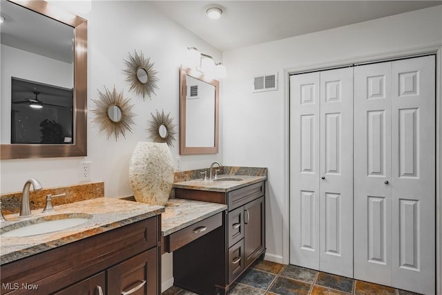 5500 12th Ave, Vienna, WV 26105 - bathroom featuring a closet, vanity, stone finish floors, and baseboards