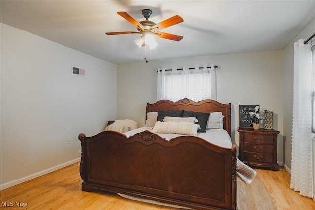 5500 12th Ave, Vienna, WV 26105 - bedroom with light wood-type flooring, baseboards, and a ceiling fan