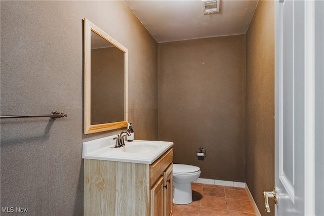 5500 12th Ave, Vienna, WV 26105 - bathroom with vanity, toilet, tile patterned floors, and baseboards