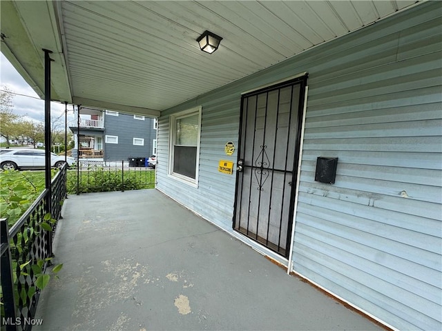 12423 Phillips Ave, Cleveland, OH 44108 - view of patio / terrace with a porch and an attached carport