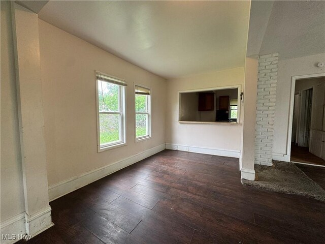 12423 Phillips Ave, Cleveland, OH 44108 - unfurnished living room featuring hardwood / wood-style flooring and baseboards