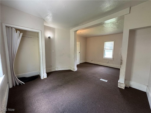 12423 Phillips Ave, Cleveland, OH 44108 - unfurnished bedroom featuring carpet flooring, baseboards, and a textured ceiling