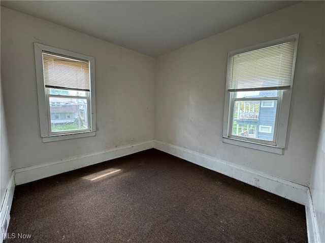 12423 Phillips Ave, Cleveland, OH 44108 - empty room with dark carpet and baseboards