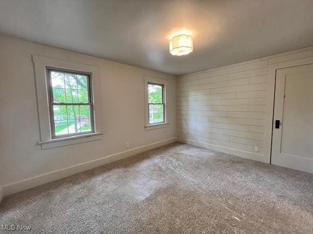 713 N Broadway St, New Philadelphia, OH 44663 - empty room with carpet flooring and baseboards