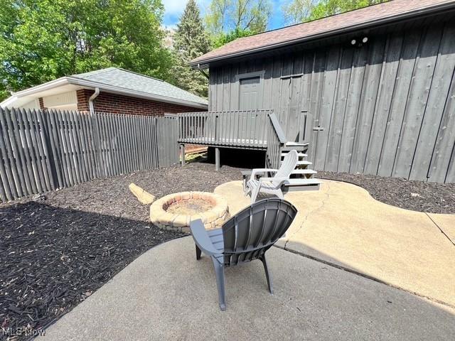 713 N Broadway St, New Philadelphia, OH 44663 - view of patio / terrace with fence and a deck
