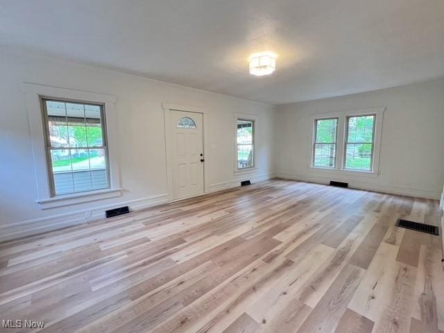 713 N Broadway St, New Philadelphia, OH 44663 - entryway with plenty of natural light, light wood finished floors, and baseboards