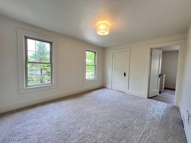 713 N Broadway St, New Philadelphia, OH 44663 - unfurnished bedroom with carpet floors and baseboards