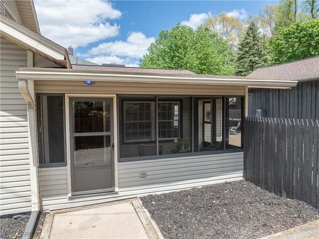 713 N Broadway St, New Philadelphia, OH 44663 - property entrance with a shingled roof