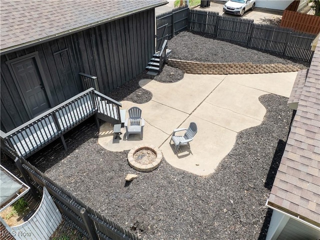 713 N Broadway St, New Philadelphia, OH 44663 - view of patio / terrace featuring fence and a fire pit