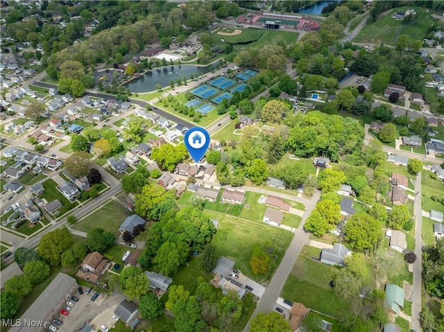 713 N Broadway St, New Philadelphia, OH 44663 - aerial overview of property's location with a nearby body of water and nearby suburban area