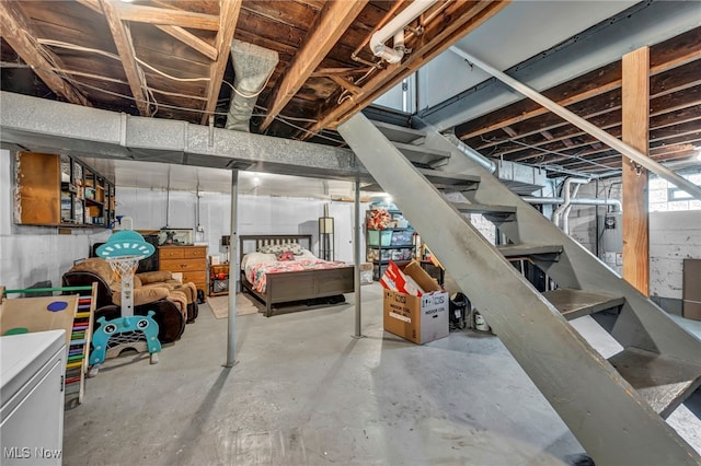 unfinished basement with stairway