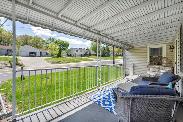 sunroom / solarium with a residential view