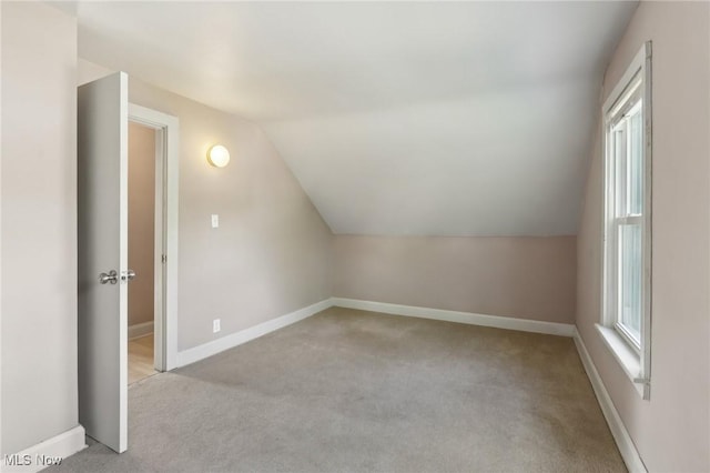 1540 Grand Park Ave, Akron, OH 44310 - bonus room with lofted ceiling, light carpet, and baseboards