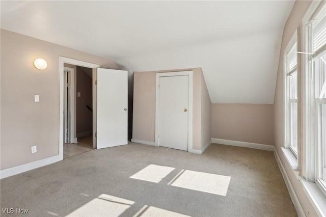 1540 Grand Park Ave, Akron, OH 44310 - additional living space with carpet floors, lofted ceiling, and baseboards